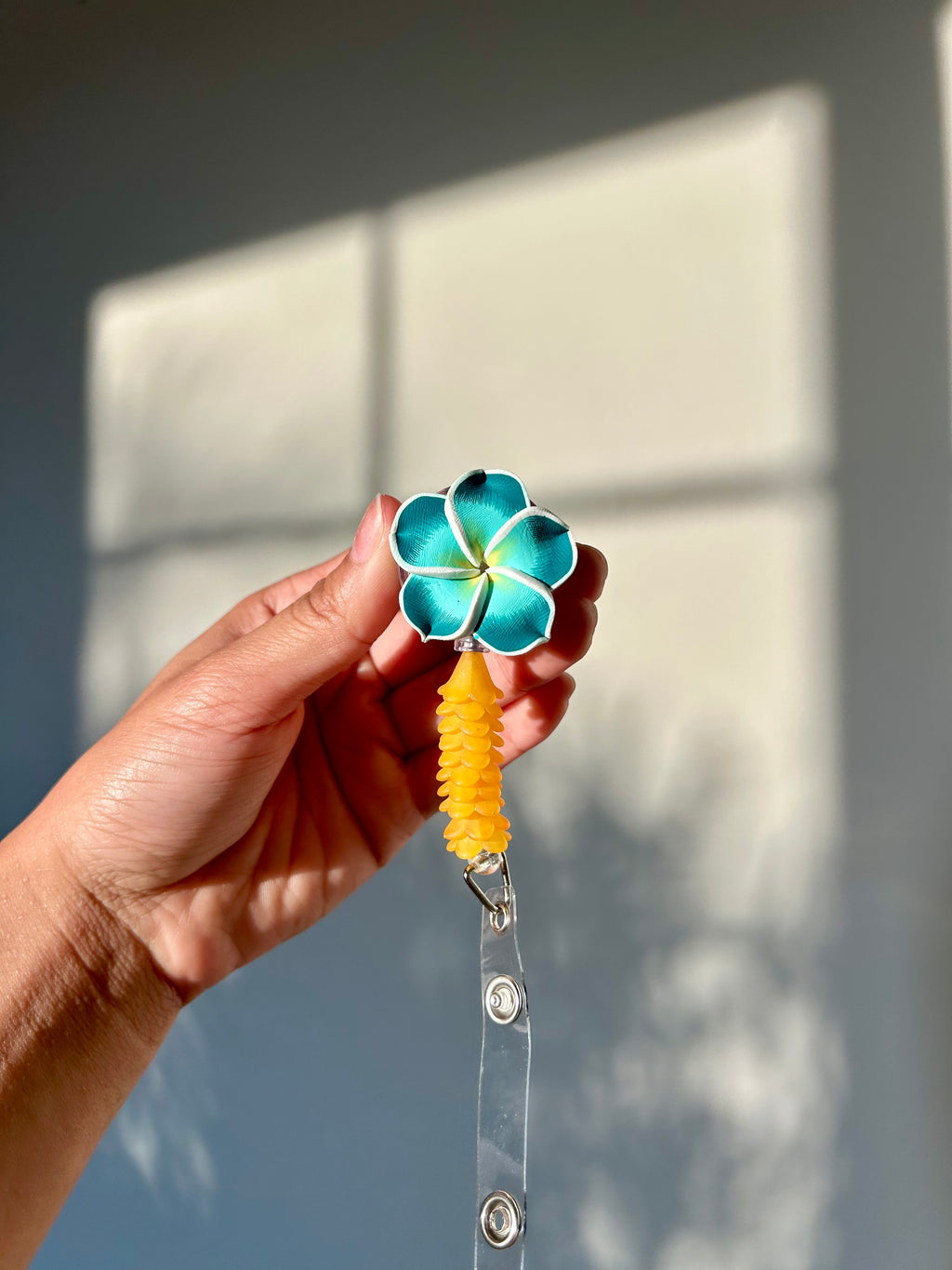 Teal Mini Puakenikeni Lei Badge Reel