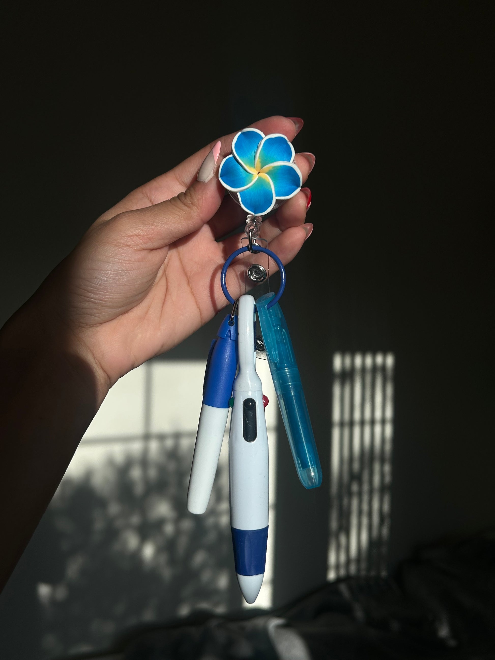 Blue Plumeria Badge Reel Pen Set