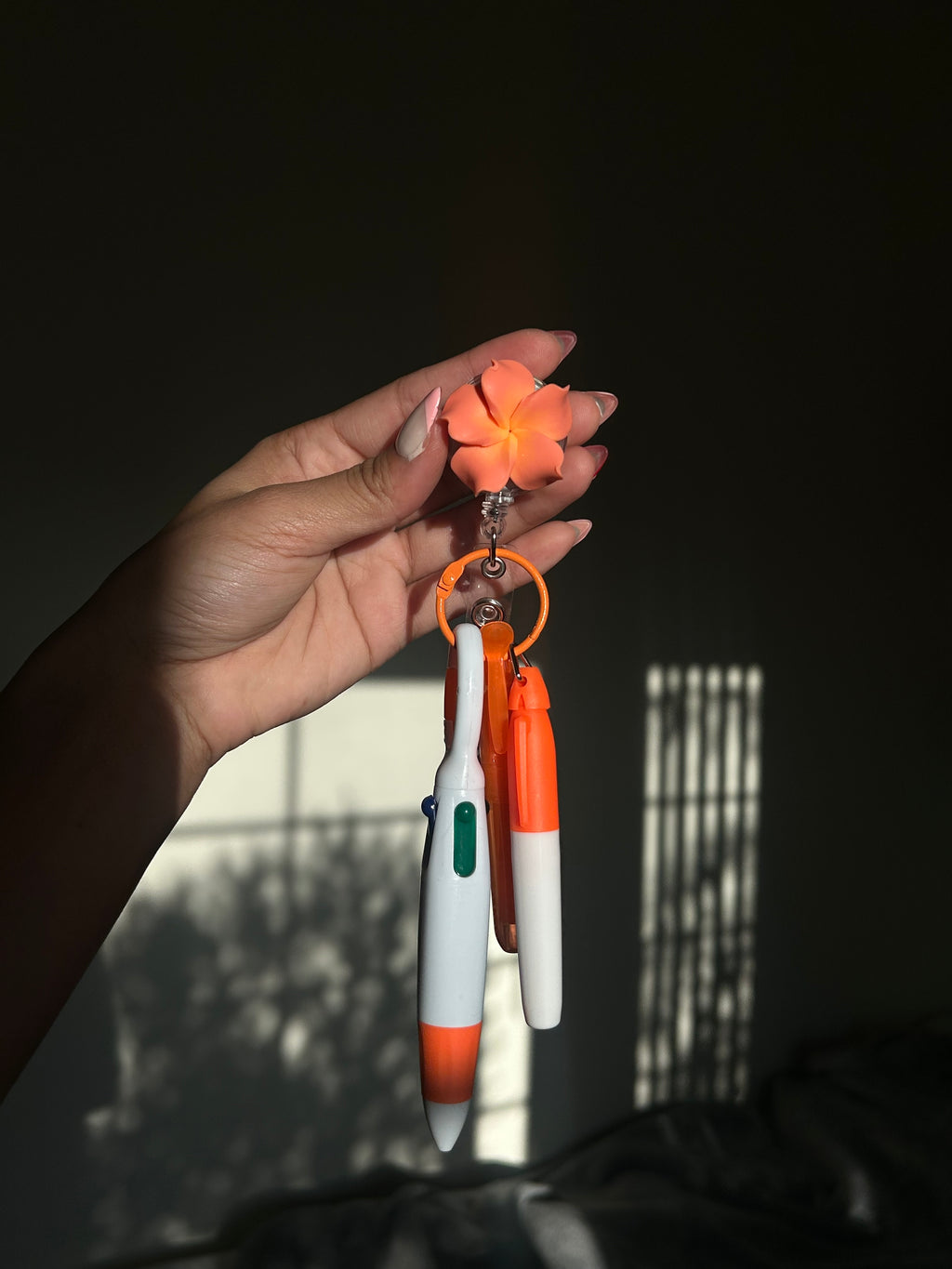 Orange Plumeria Badge Reel Pen Set
