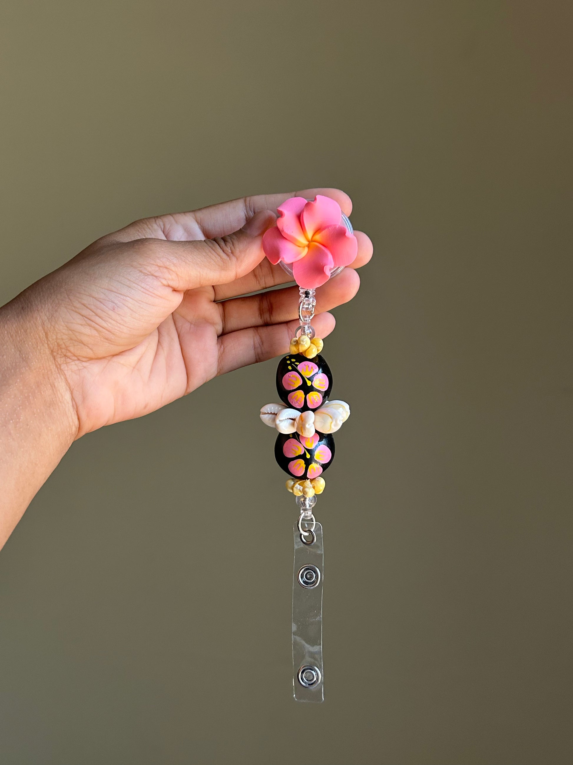 Coral Kukui Nut Lei Badge Reel