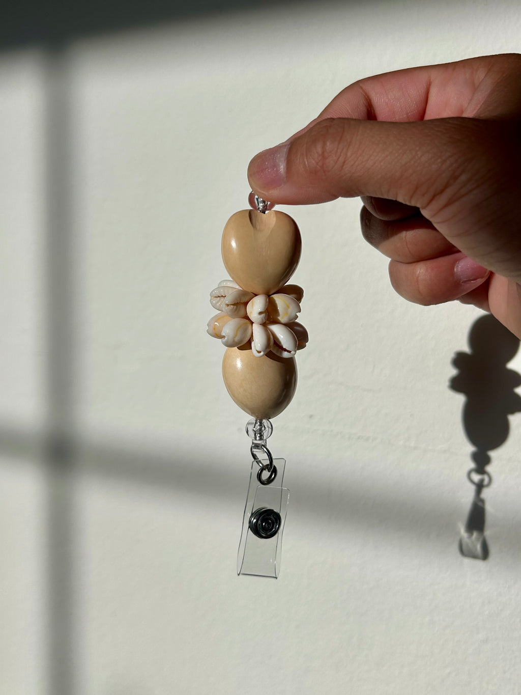 Plumeria Badge Reel Lei - Coral