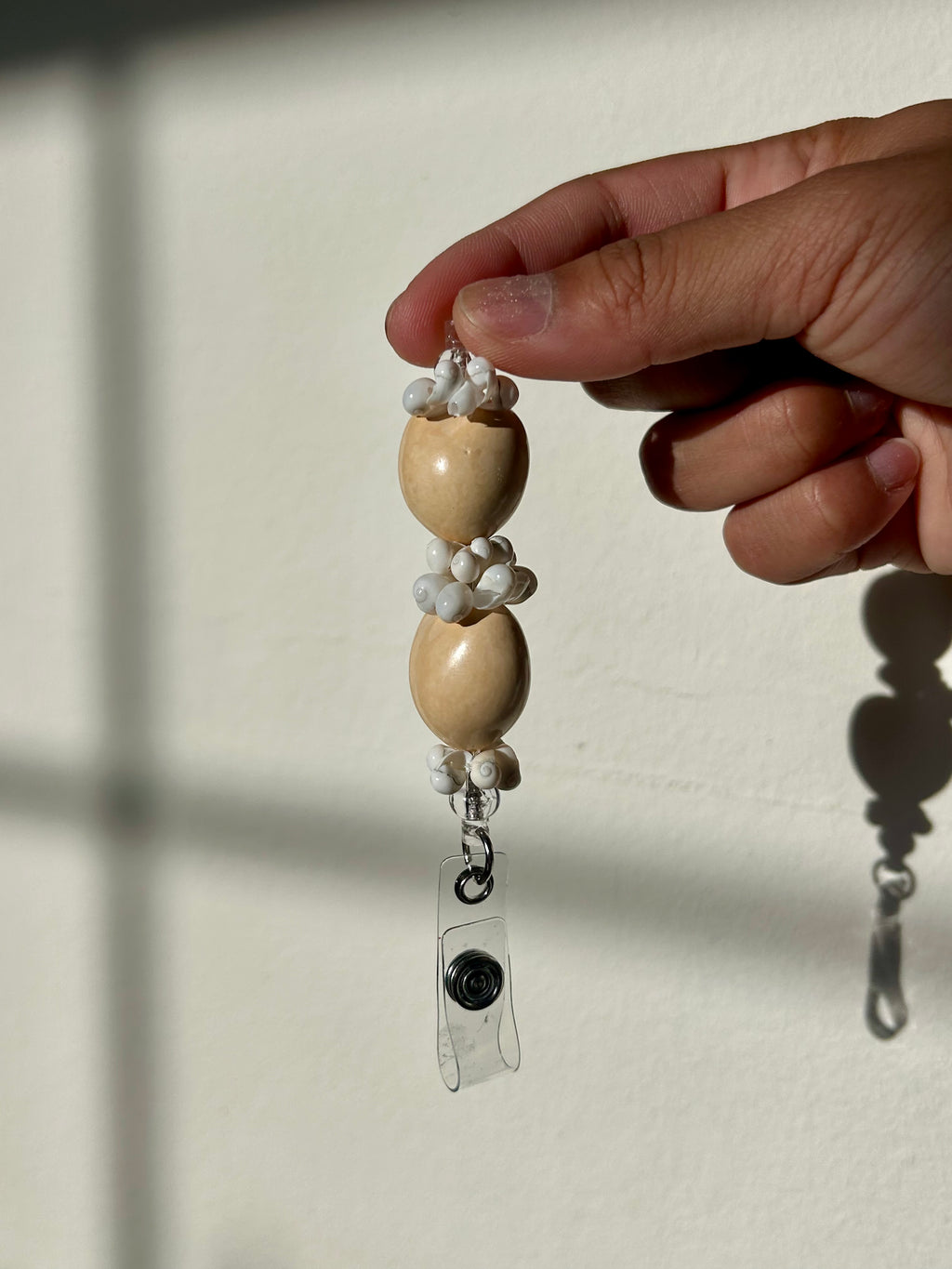 Plumeria Badge Reel Lei - Coral