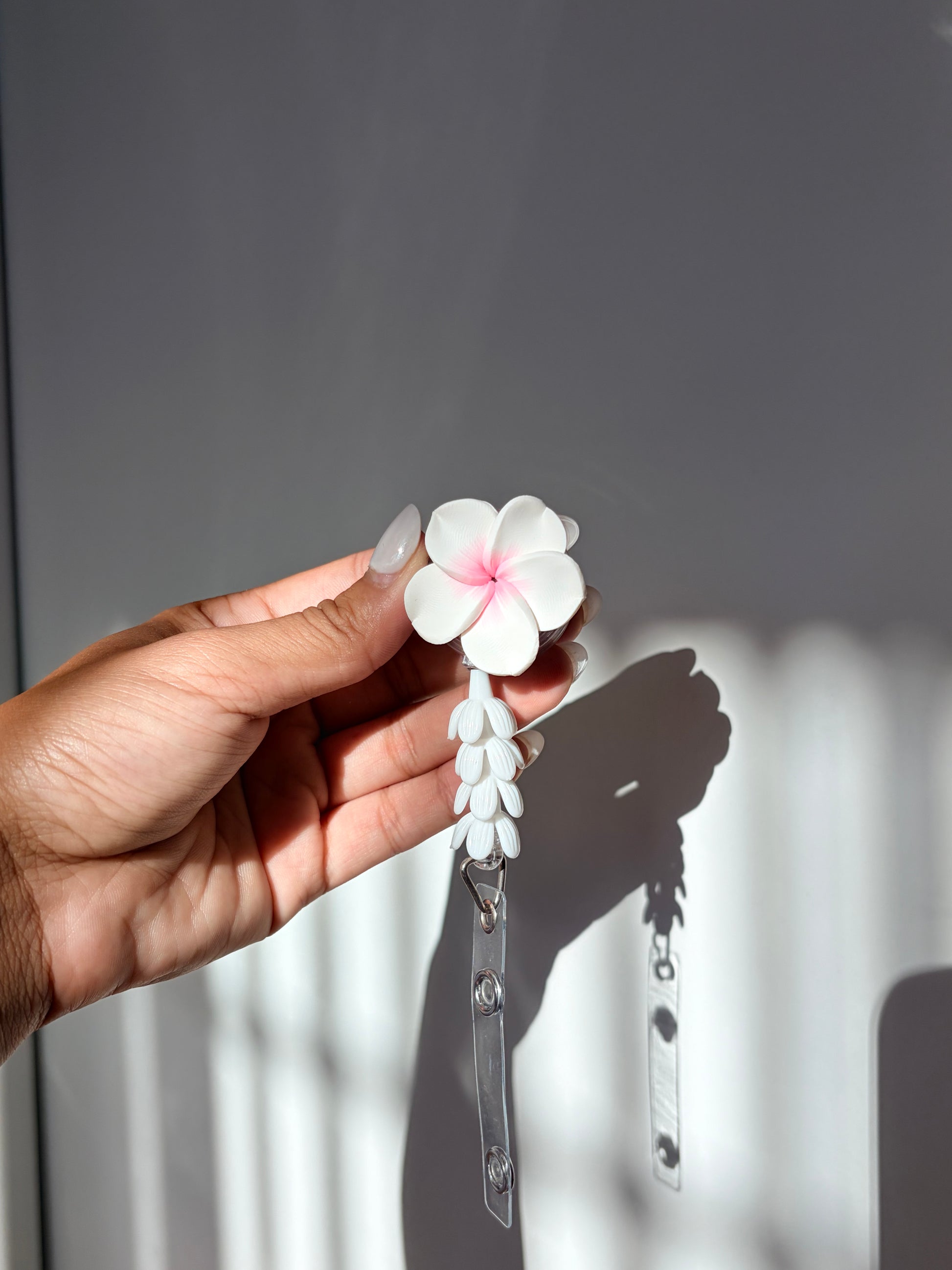 White and Pink Plumeria Mini Pikake Badge Reel