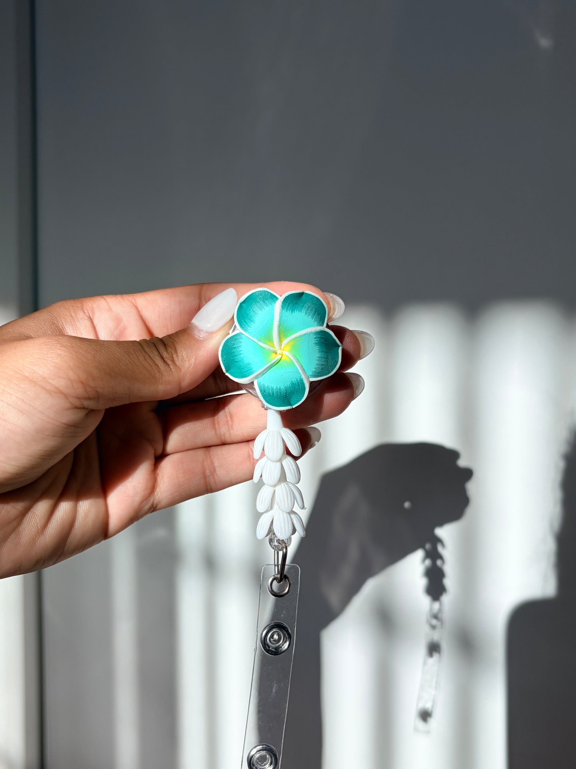 Teal Plumeria Mini Pikake Badge Reel