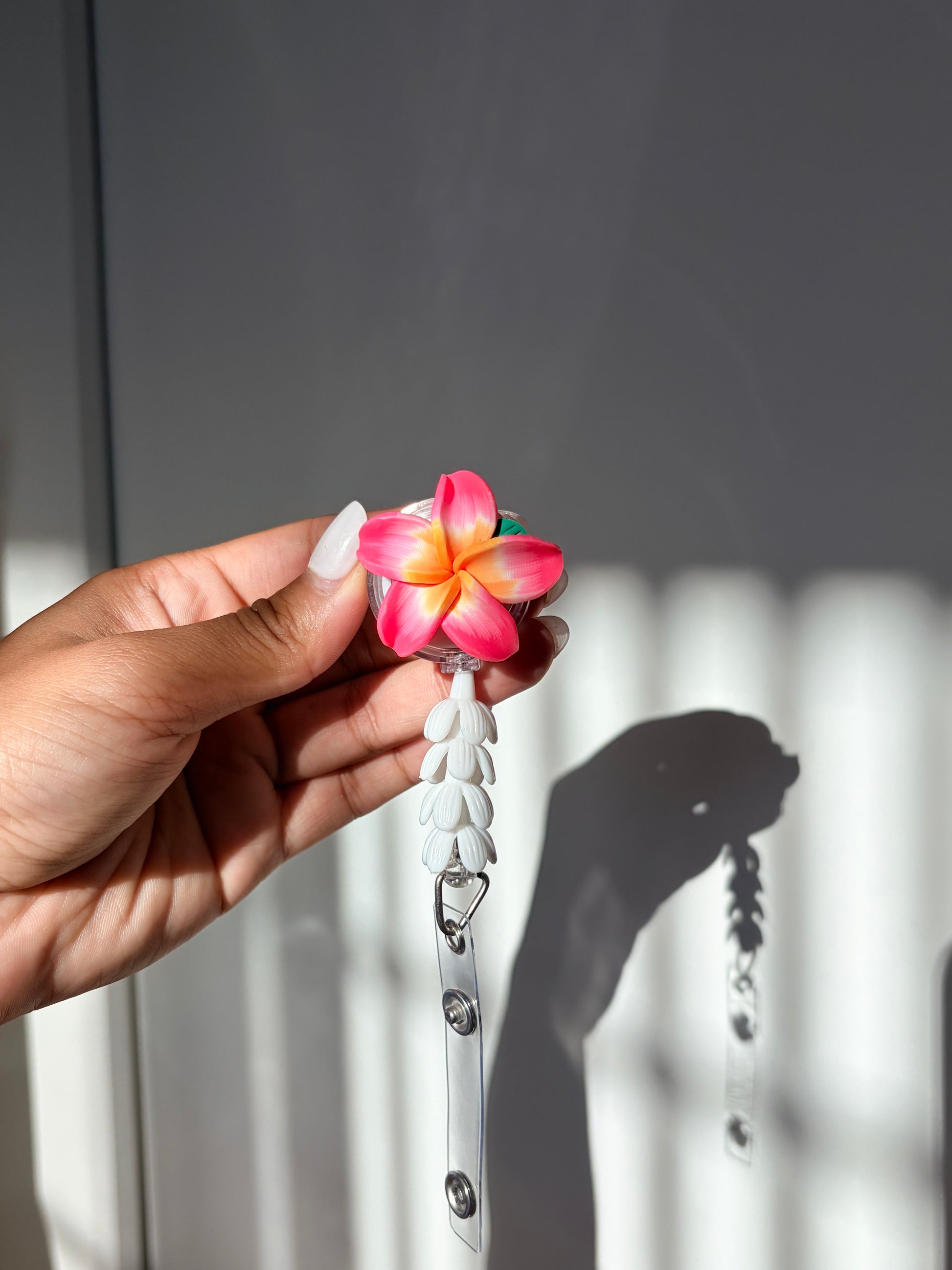Tiare Plumeria Mini Pikake Badge Reel