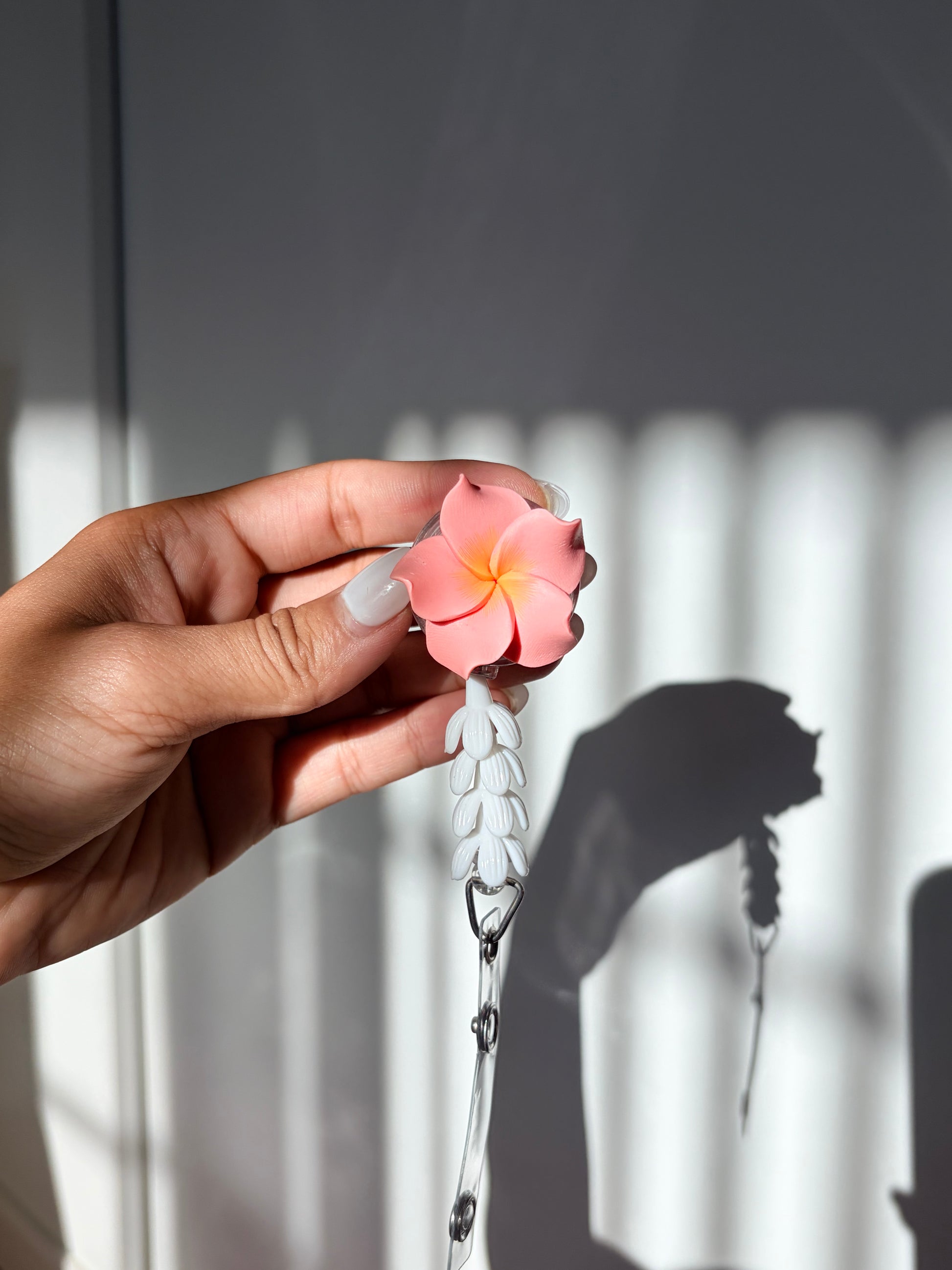 Coral Plumeria Mini Pikake Badge Reel