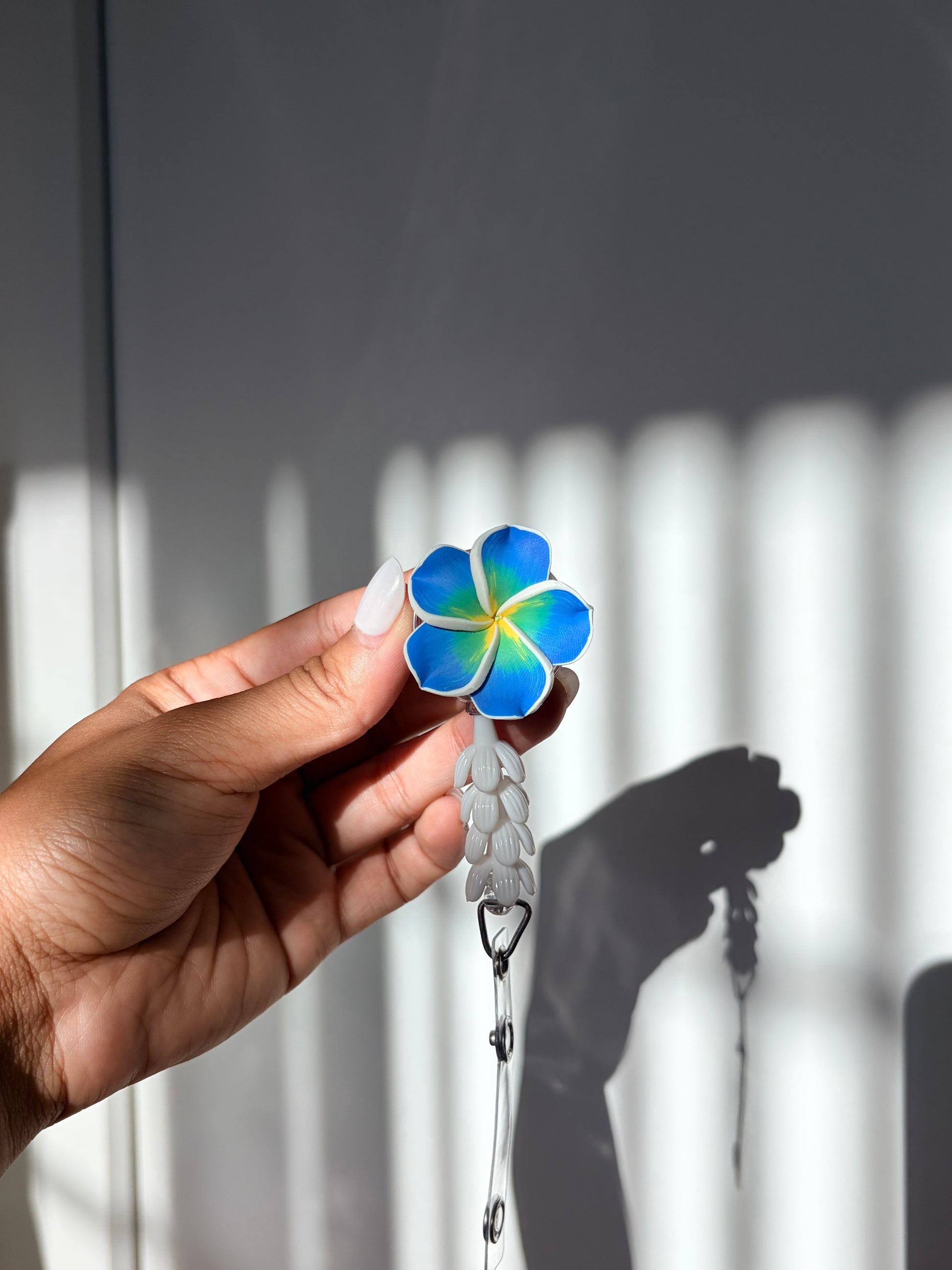 Blue Plumeria Mini Pikake Badge Reel