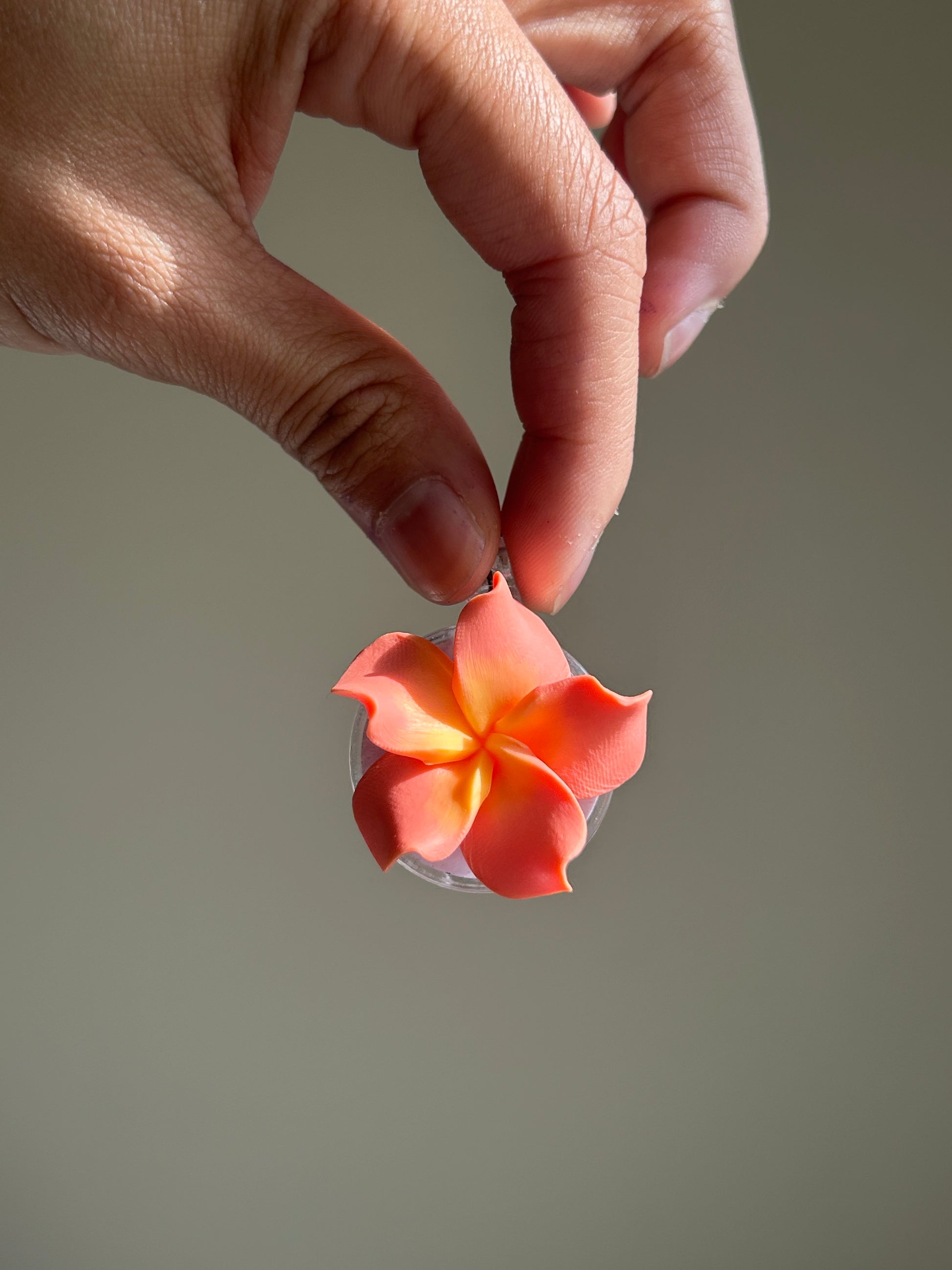 Plumeria Badge Reel Lei - Coral