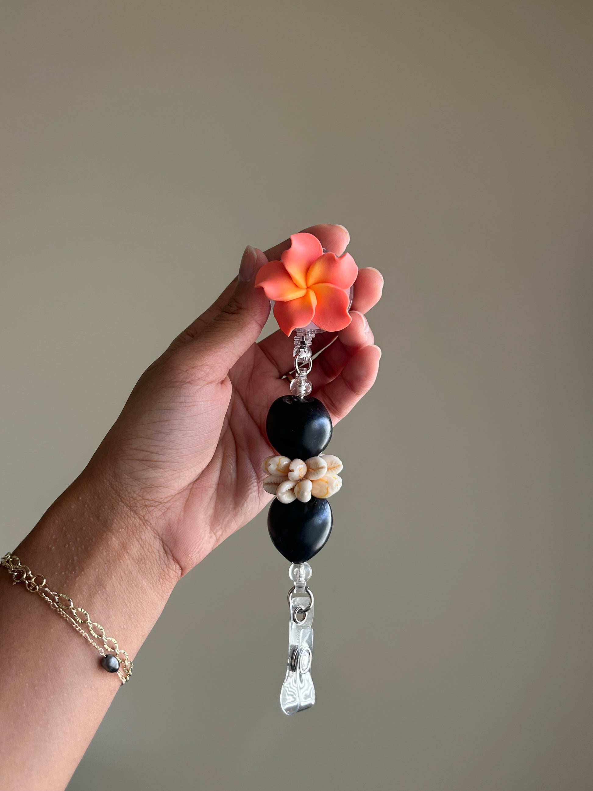 Plumeria Badge Reel Lei - Coral