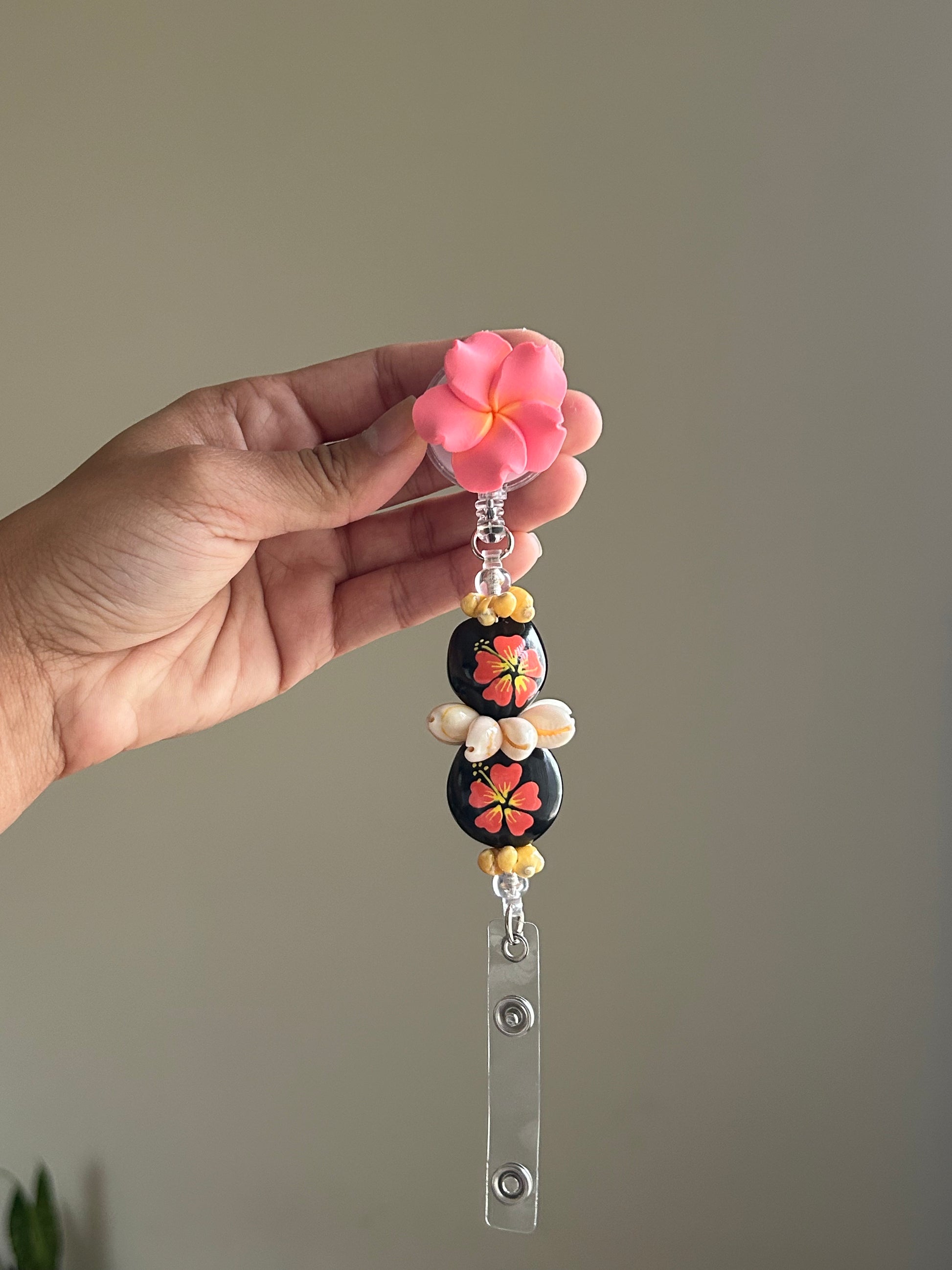 Coral Kukui Nut Lei Badge Reel