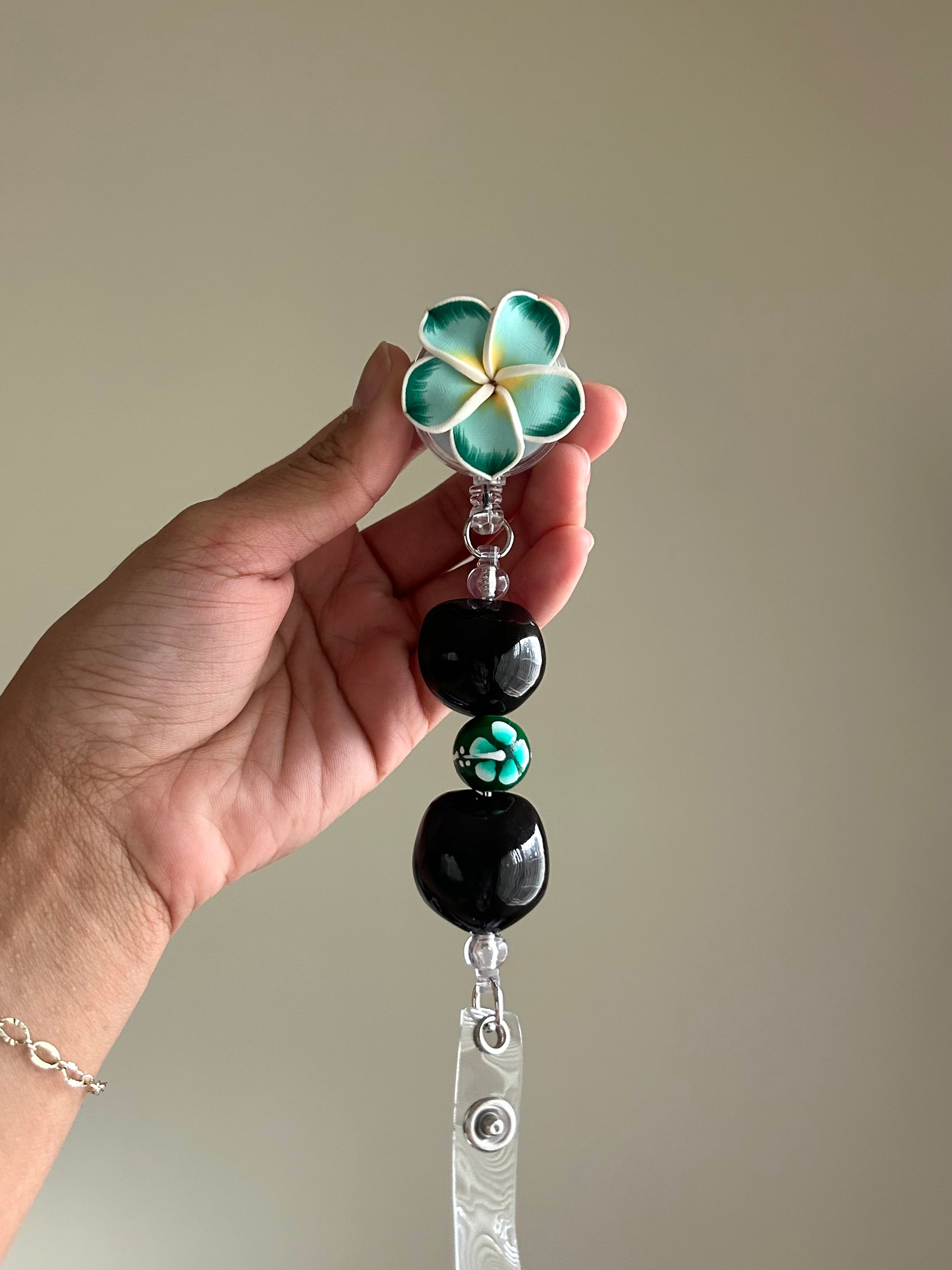 Teal Plumeria Badge Reel Lei